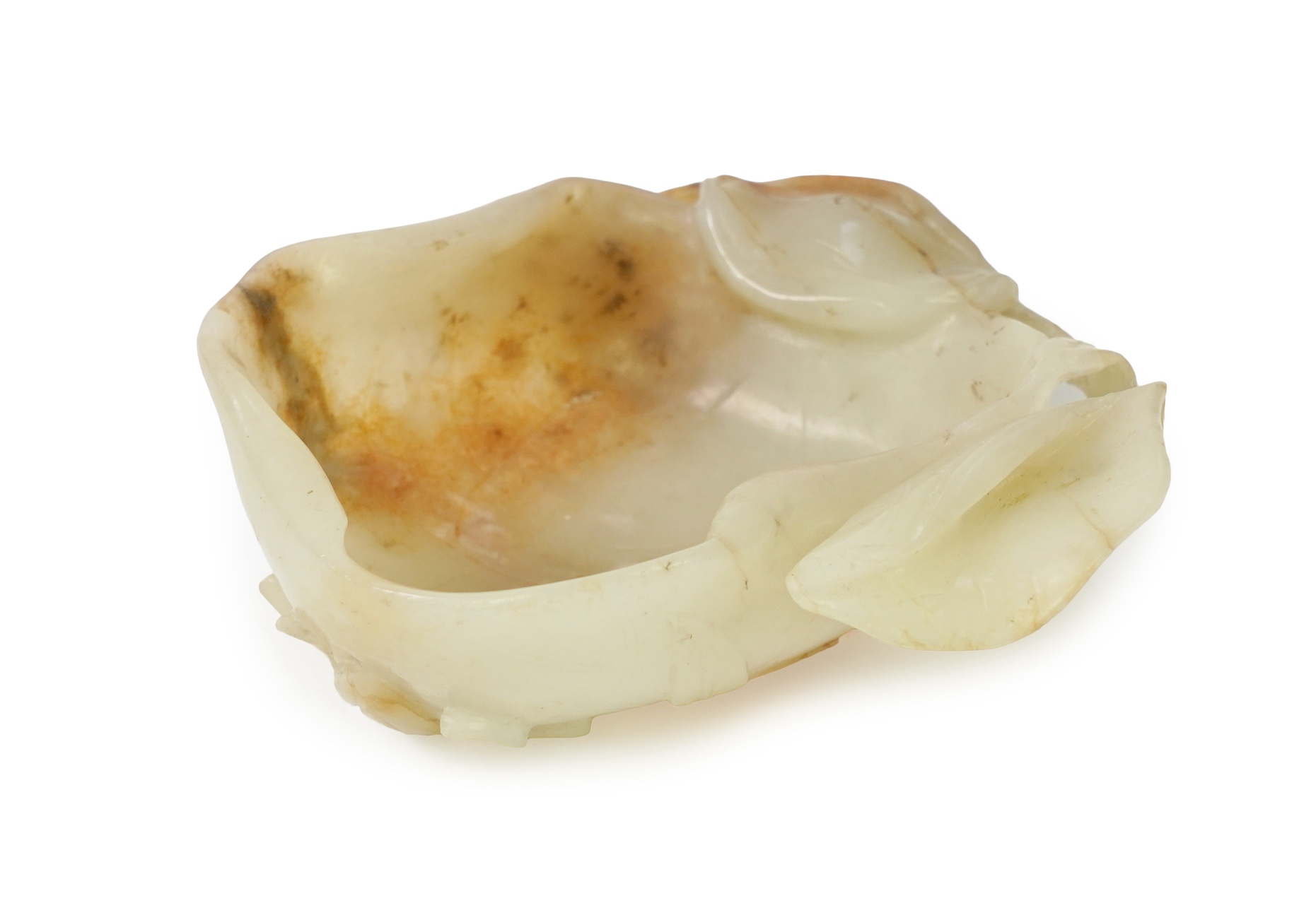A Chinese pale celadon and russet jade brushwasher, Ming dynasty, 16th/17th century